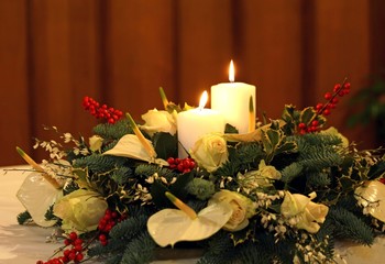 bouquet with calla lilies, white flowers and lit two candles and