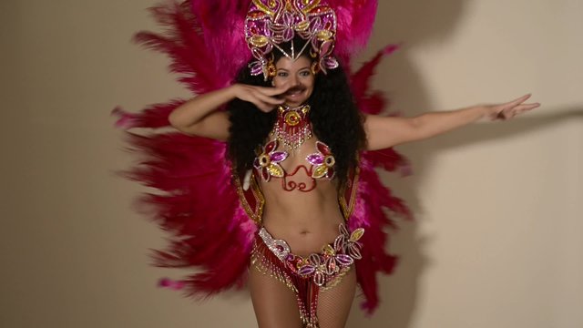 Beautiful samba dancer wearing typical pink costume