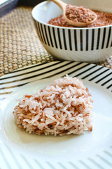 Brown rice on wooden table
