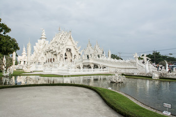 Fototapeta na wymiar Wat Rong khun is known among foreigners as the White Temple in C