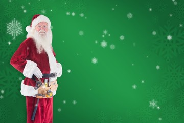 Composite image of father christmas is wearing a tool belt