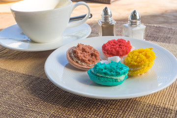 More colorful macarons  on fabric background