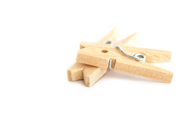 Wooden clothes peg isolated on white background