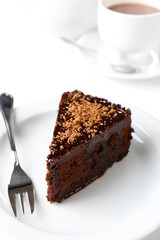 Yummy chocolate cake served on table