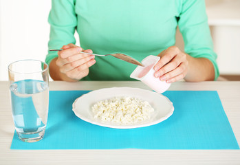 Obraz na płótnie Canvas Girl and dietary food at table close-up