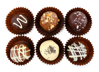 Delicious chocolate candies isolated on white