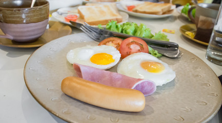 English breakfast with fried eggs, bacon, sausages,