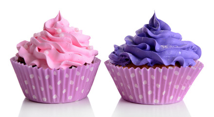 Delicious cupcakes isolated on white