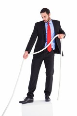 Businessman pulling a rope with effort