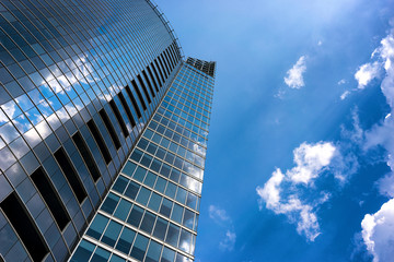 Fototapeta na wymiar Reflection of clouds in a modern building