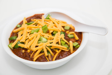 Chilli in White Bowl with Cheese and Poblano Peppers