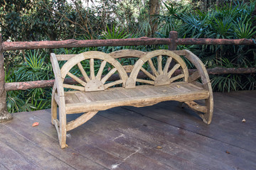 Wooden park bench in gaden