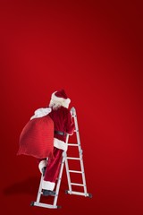 Composite image of santa steps up a ladder
