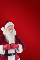 Composite image of santa claus wears boxing gloves