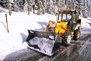 clearing roads of snow and fallen tree