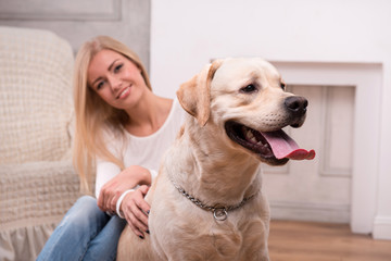 Beautiful  blond girl with Labrador Retriever