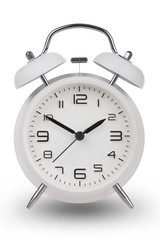 White alarm clock with the hands at 10 and 2