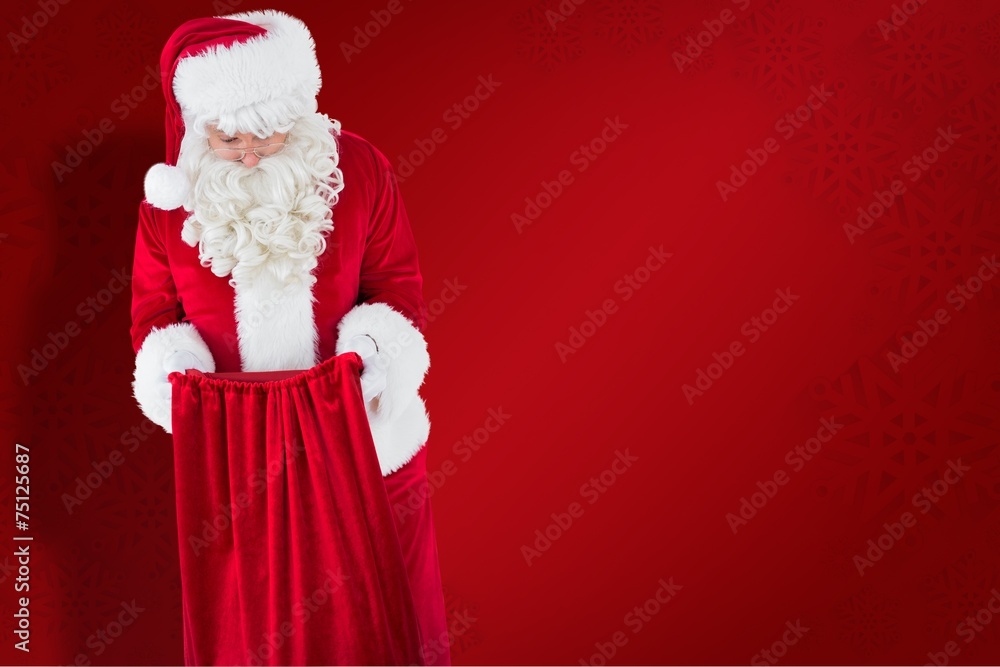 Poster composite image of santa claus looking in sack