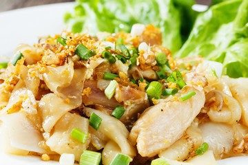 Stir fried fresh rice fat noodles with chicken and egg