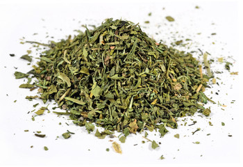 Heap of dried parsley on a white