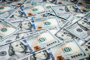 One hundred dollars pile as background