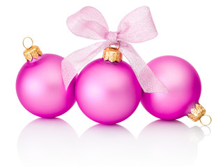 Three pink christmas balls with ribbon bow Isolated on white bac