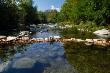 Dam from stones  on the mountain river