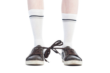 Long socks and shoe laces tied together prank