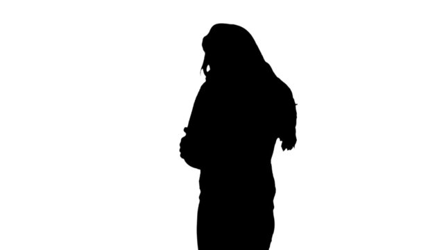 Silhouette of woman shivering