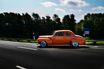 Obraz na płótnie Canvas Classic car on the road