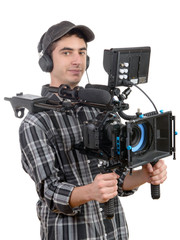 young cameraman with professional camera