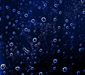Fototapeta na wymiar Water drops on glass