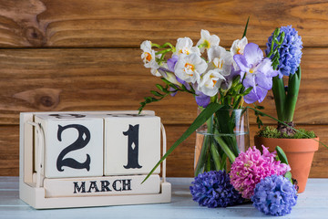 First day of spring flowers and calendar