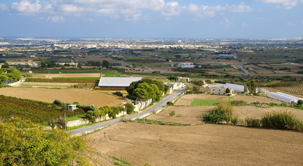 Fototapeta na wymiar Autumn maltese landscape ,village with cultivated fields.