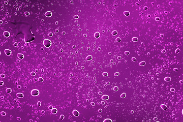 Drops of water on the glass a pink