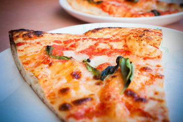 Traditional slise of pizza margarita