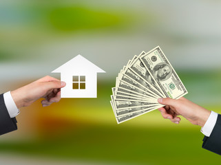 hand giving money for housing