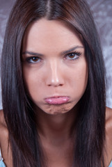 Obraz premium Young brunette woman making face expression