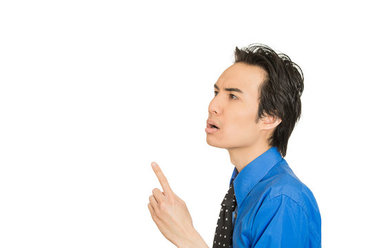 man in blue shirt pointing finger up he solved problem