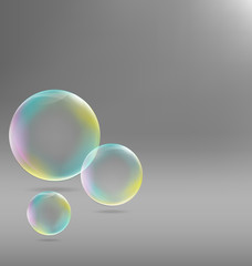 Three transparent soap bubbles with shadows on grayscale backgro