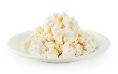 Fresh cottage cheese in round plate