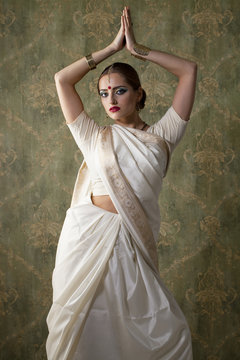 Young pretty woman in indian white dress