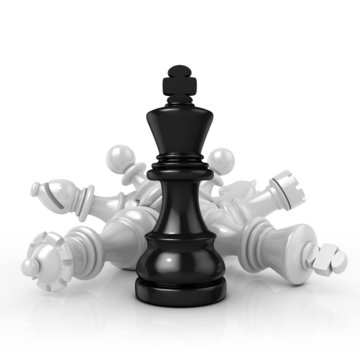 Black king standing over fallen black chess pieces, isolated