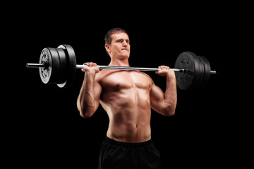 Fototapeta na wymiar Determined athlete lifting a heavy weight