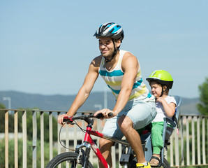 Father with child on bicycle