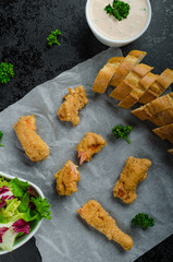 Salmon in herb batter with spicy dressing