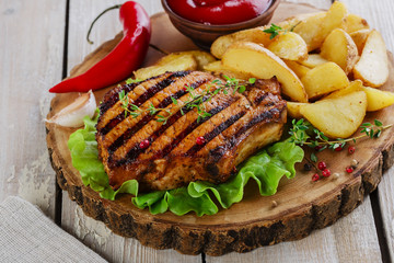 Grilled steak on the bone with potatoes