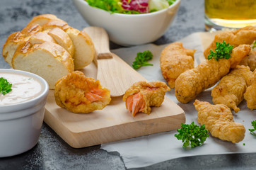 Salmon in herb batter with spicy dressing