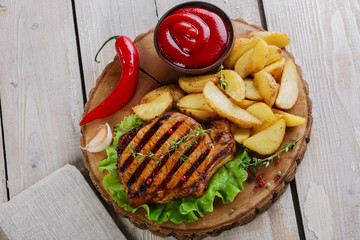Grilled steak on the bone with potatoes