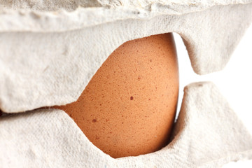 Detail of a egg covered in a box.